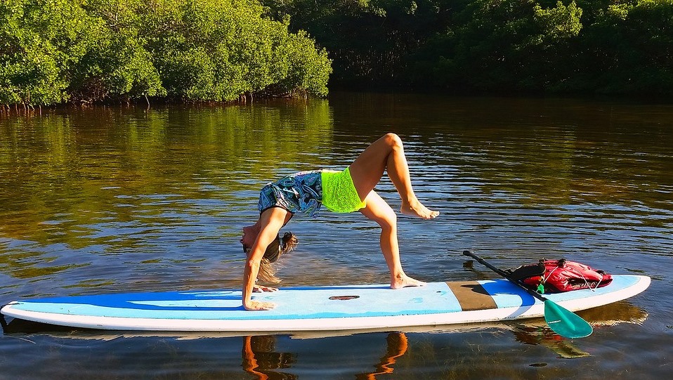 doing yoga on a paddle board